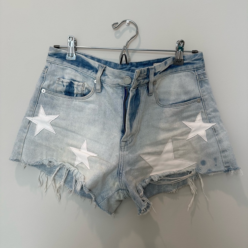 Blanknyc distressed denim shorts with white leather star patches